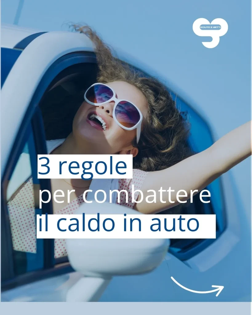 SCIUTO SOCCORSO STRADALE IN ESTATE - A girl smiling and enjoying the breeze while sticking her head out of a car window.